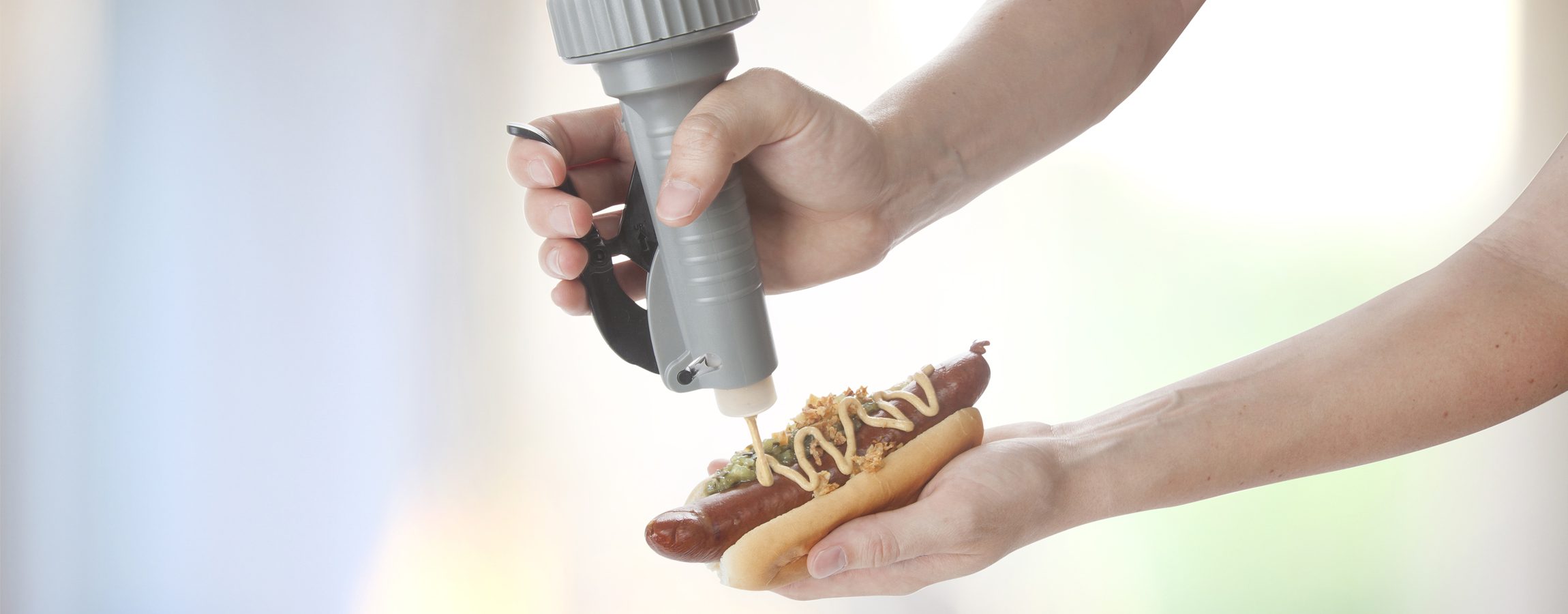 Portion pump a handheld Condiment Dispenser